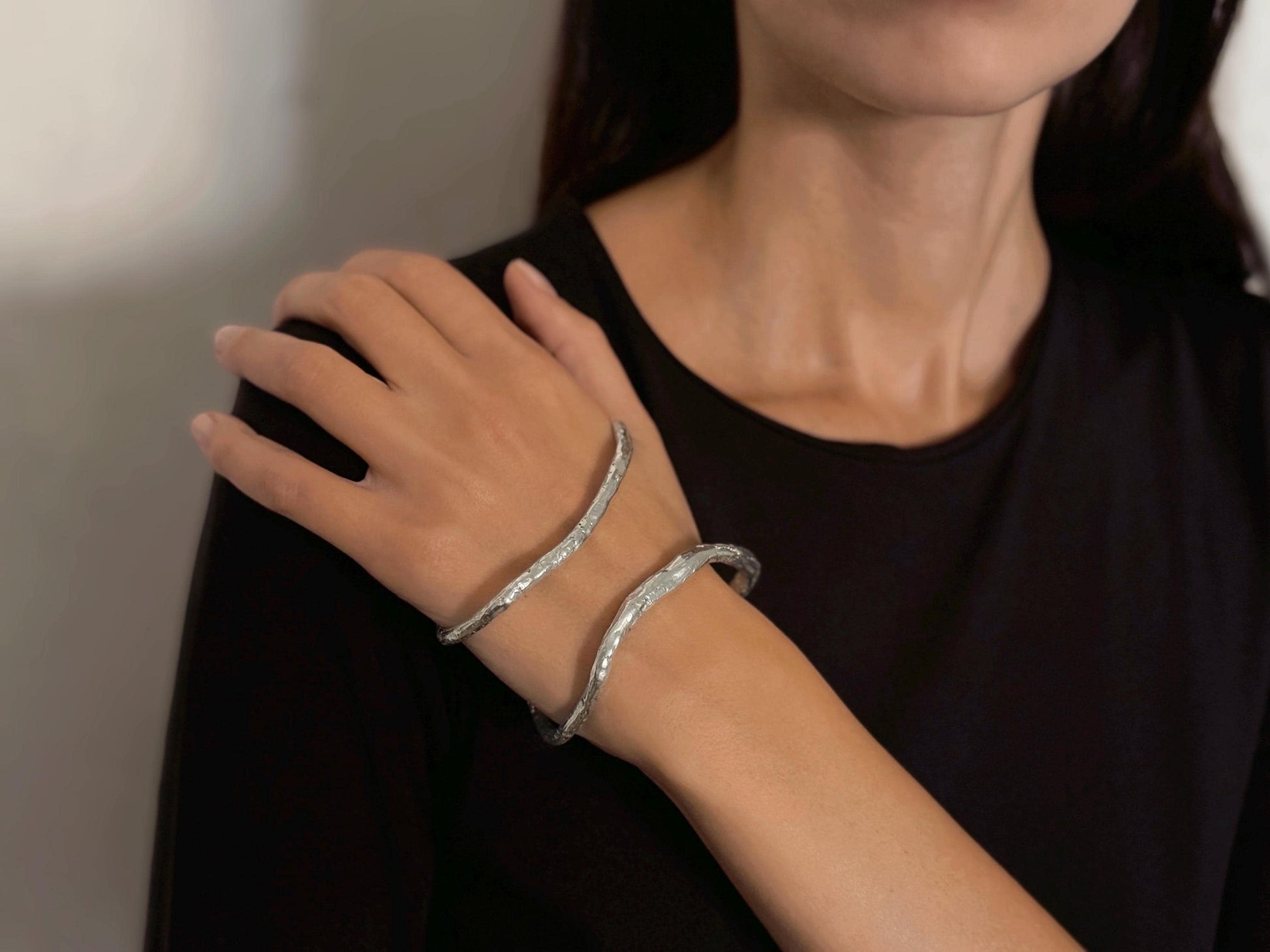 Person wearing sterling silver palm cuff bracelet